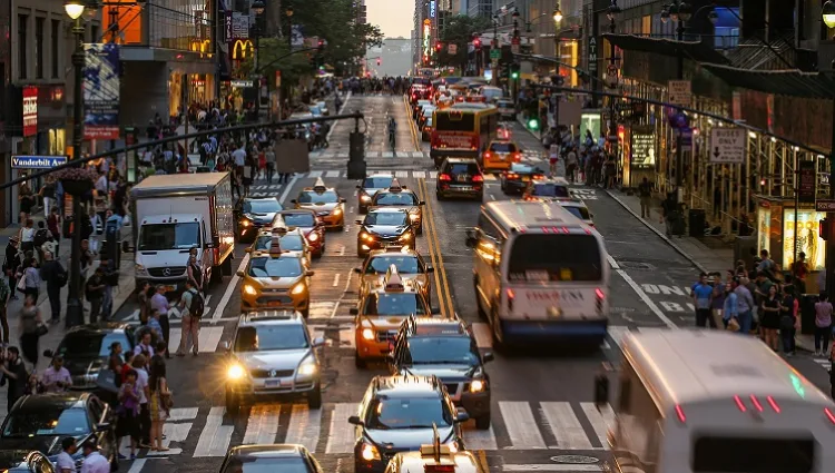 Busy Santa Monica street traffic at dusk representing urban noise pollution requiring acoustic testing